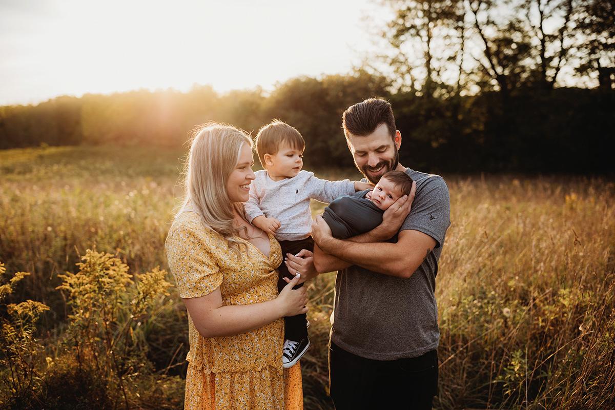 outdoor newborn family session at sunset