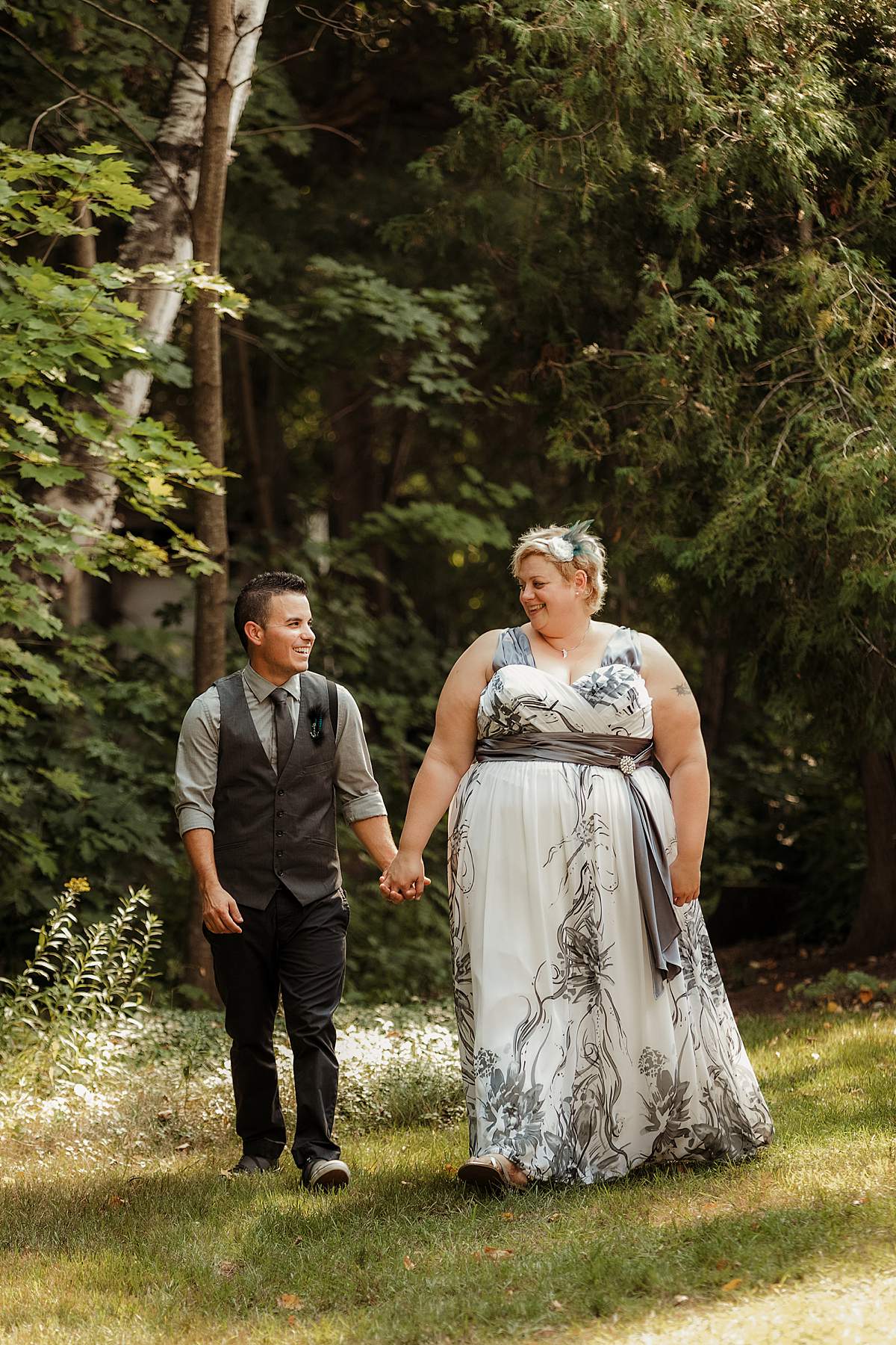 couple walking at cottage wedding