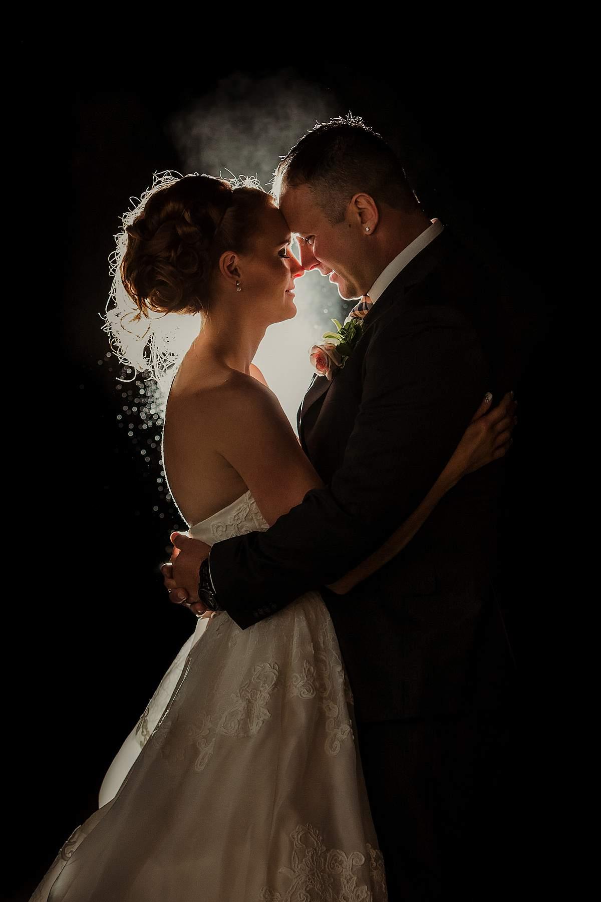 backlit off-camera flash wedding couple with smoke
