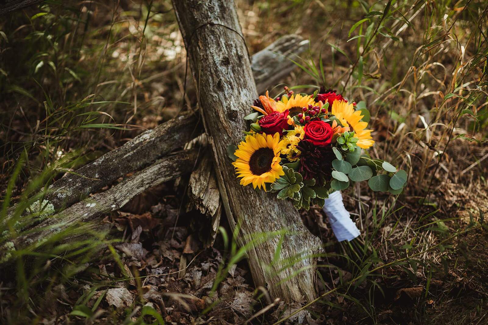 sunflower bridal bouquet against old fence