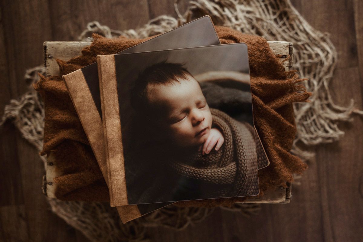Heirloom album with velvet and acrylic photo cover with a photo of a sleeping baby on the front.